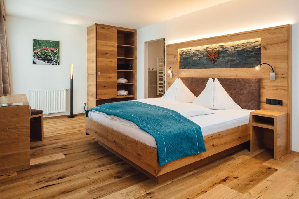 Postel nebo postele na pokoji v ubytování Hotel Post
