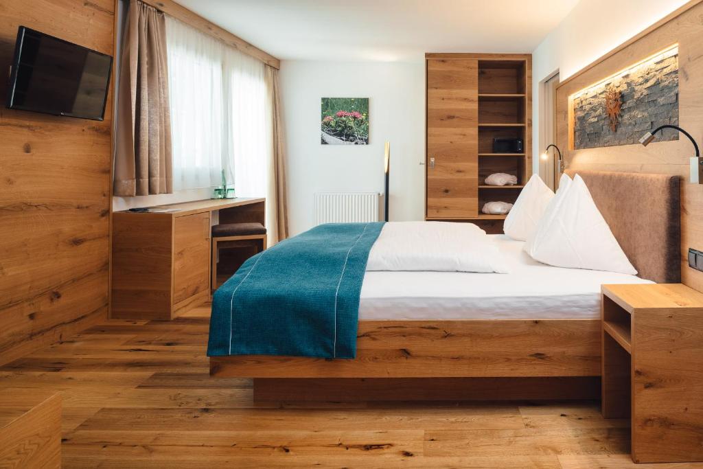 Postel nebo postele na pokoji v ubytování Hotel Post
