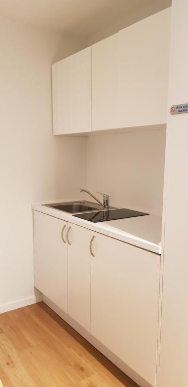 Kuchyň nebo kuchyňský kout v ubytování Haus Achtern Diek in erster Reihe am Meer