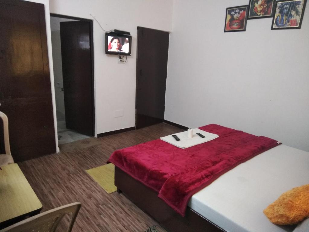Postel nebo postele na pokoji v ubytování Agra Paying Guest House