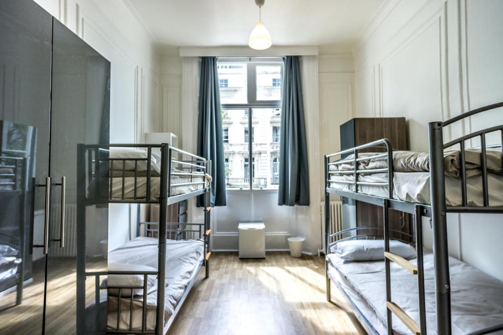 Postel nebo postele na pokoji v ubytování Sandeman-Allen Hostel (Bayswater)
