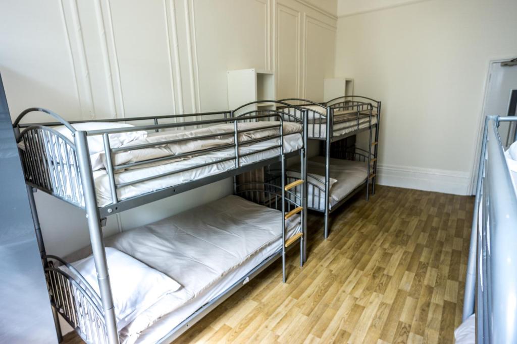 Postel nebo postele na pokoji v ubytování Sandeman-Allen Hostel (Bayswater)