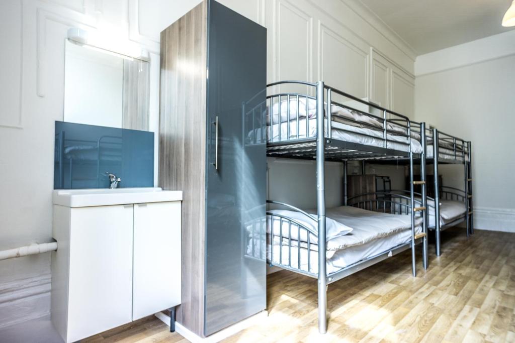 Postel nebo postele na pokoji v ubytování Sandeman-Allen Hostel (Bayswater)
