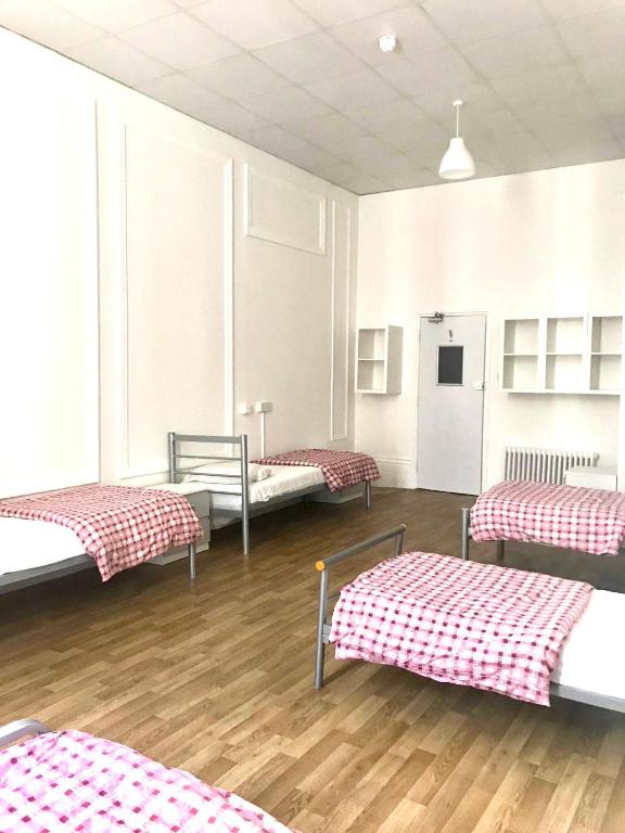 Postel nebo postele na pokoji v ubytování Sandeman-Allen Hostel (Bayswater)