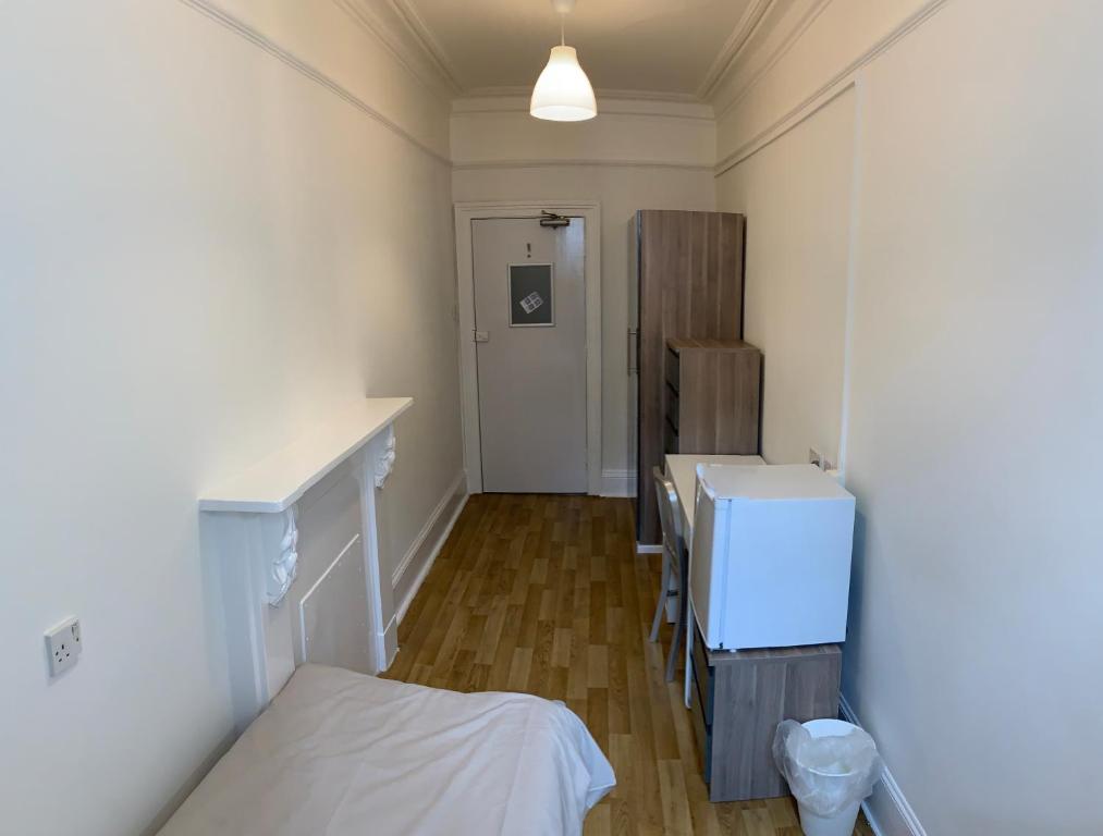 Postel nebo postele na pokoji v ubytování Sandeman-Allen Hostel (Bayswater)