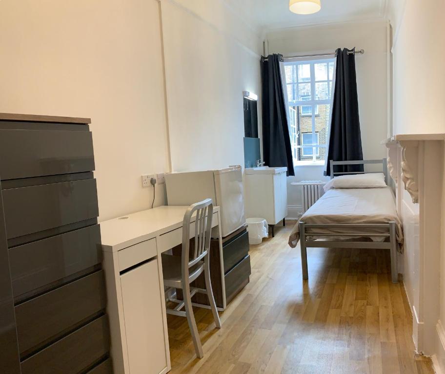 Postel nebo postele na pokoji v ubytování Sandeman-Allen Hostel (Bayswater)