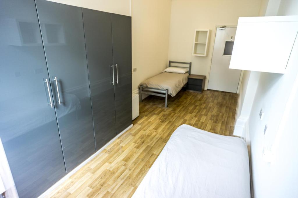Postel nebo postele na pokoji v ubytování Sandeman-Allen Hostel (Bayswater)