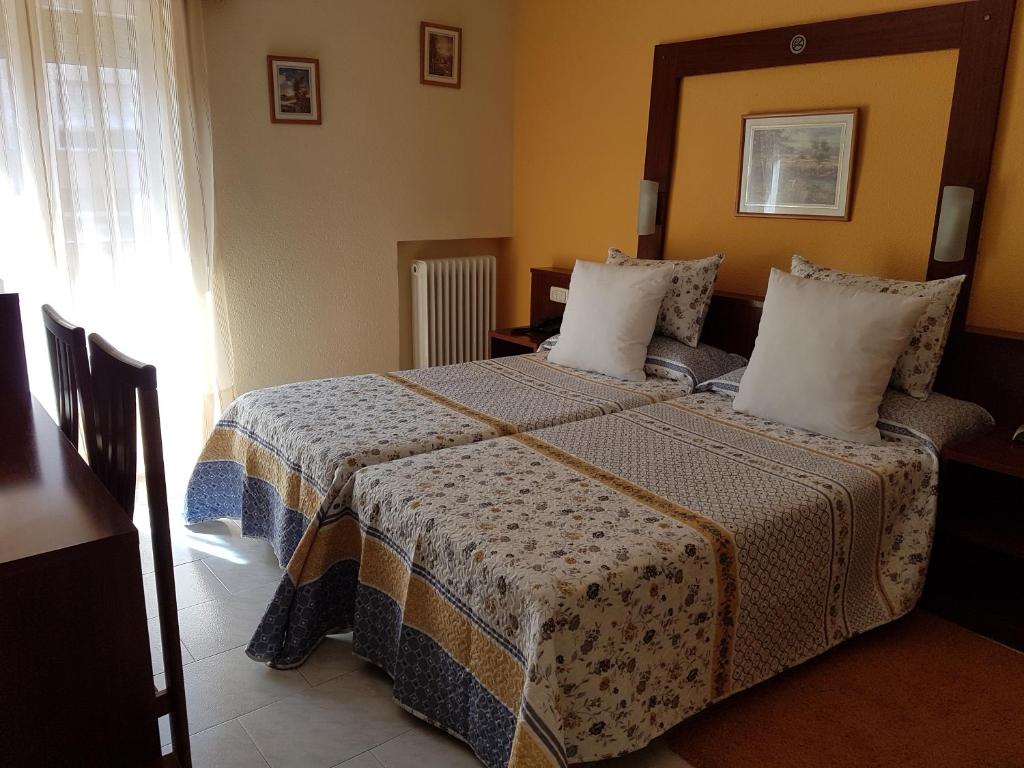 Posteľ alebo postele v izbe v ubytovaní Hotel Fray Juán Gil