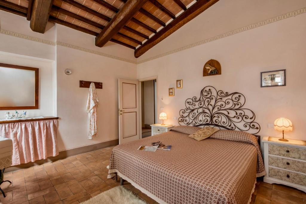 Postel nebo postele na pokoji v ubytování Agriturismo CaseGraziani