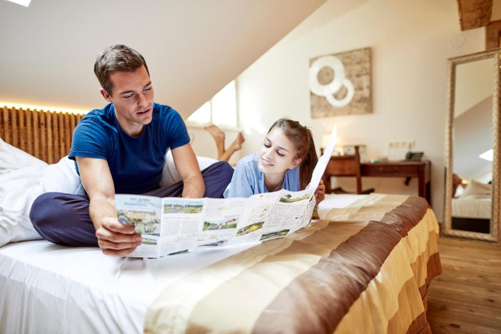 Łóżko lub łóżka w pokoju w obiekcie Hotel Landhaus Moserhof