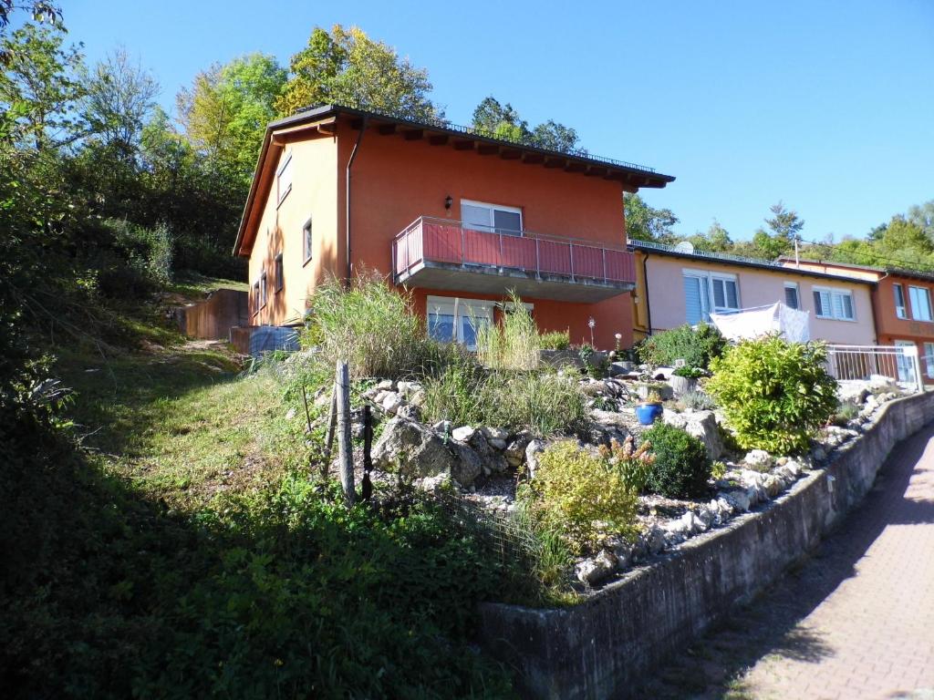 a house with a garden in front of it at Ipf Blick Ferienwohnung in Bopfingen