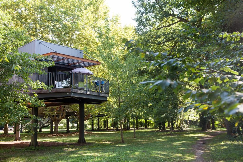 a tree house in the middle of a park at Village Vacances La Riviera Limousine by Popinns in Altillac