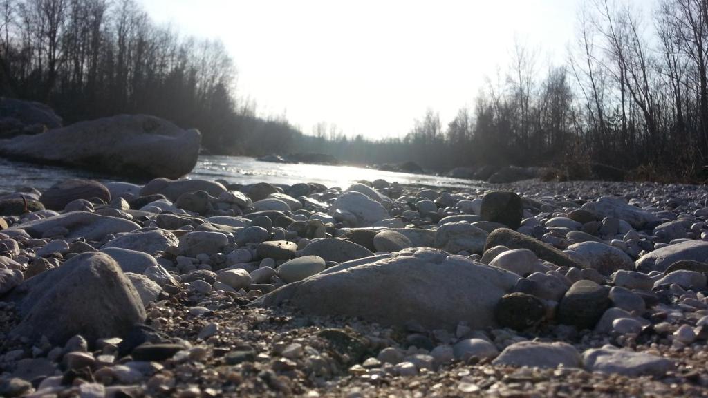 a large group of rocks on a river at l'igloo b&b in Sedico