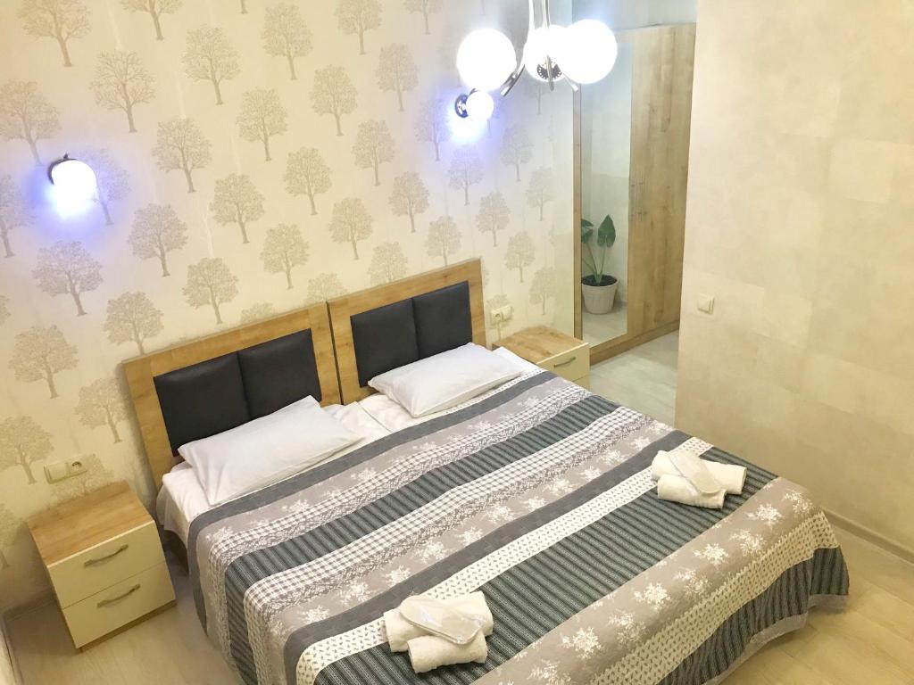 Postel nebo postele na pokoji v ubytování Guest House Imereti