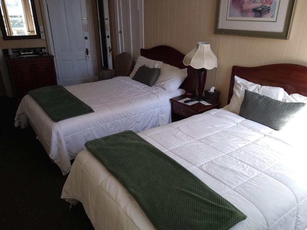 Postel nebo postele na pokoji v ubytování Hotel Wayne