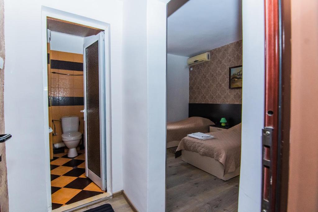 Postel nebo postele na pokoji v ubytování Vida Family Hotel
