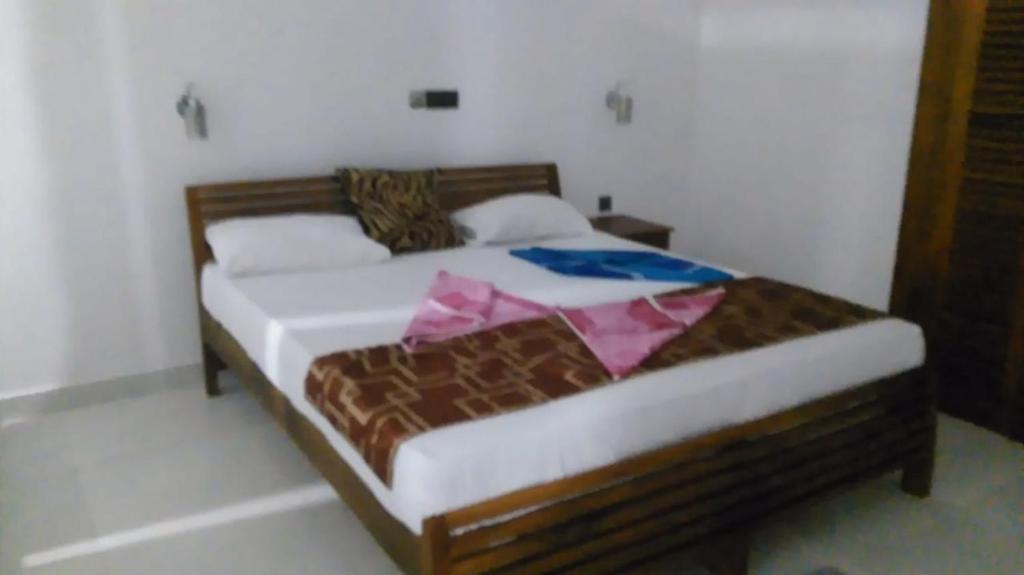 Postel nebo postele na pokoji v ubytování Happy Tuna Guesthouse
