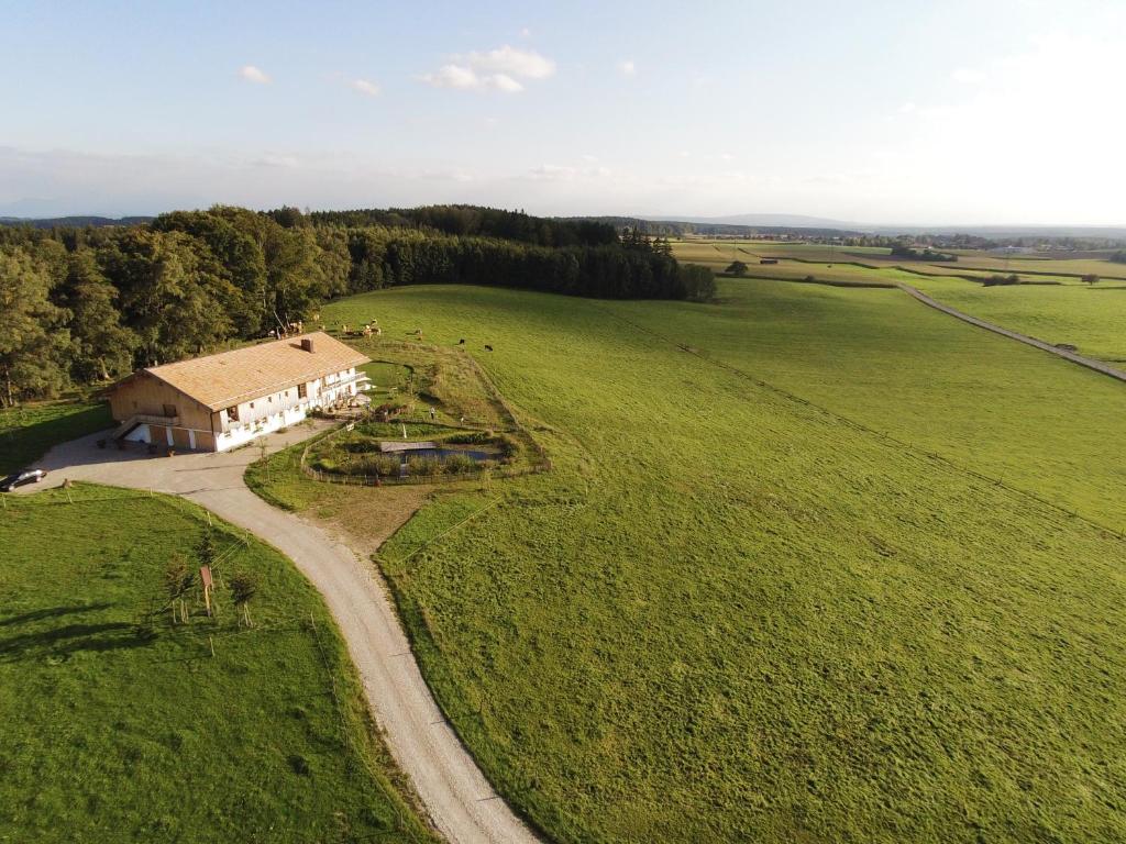 an aerial view of a house in the middle of a field at Hof Kaltenbrunn in Aying