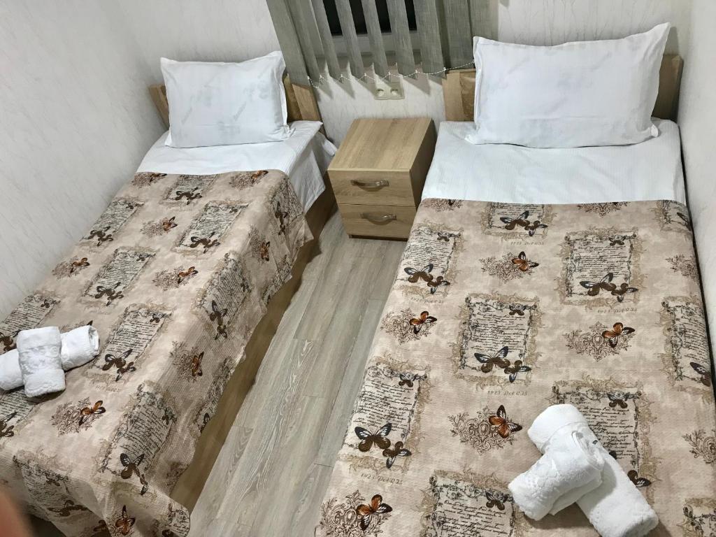 Postel nebo postele na pokoji v ubytování Guest House Imereti