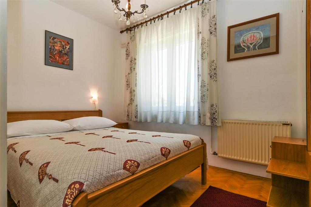 Postel nebo postele na pokoji v ubytování Apartment Lara