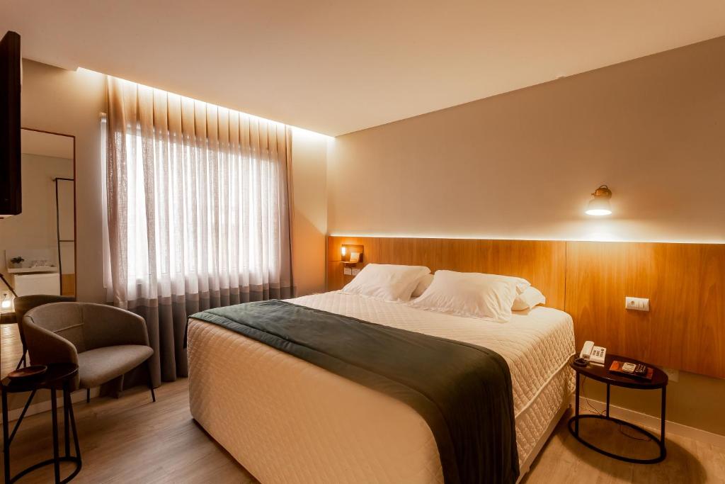 Postel nebo postele na pokoji v ubytování Hotel Melo