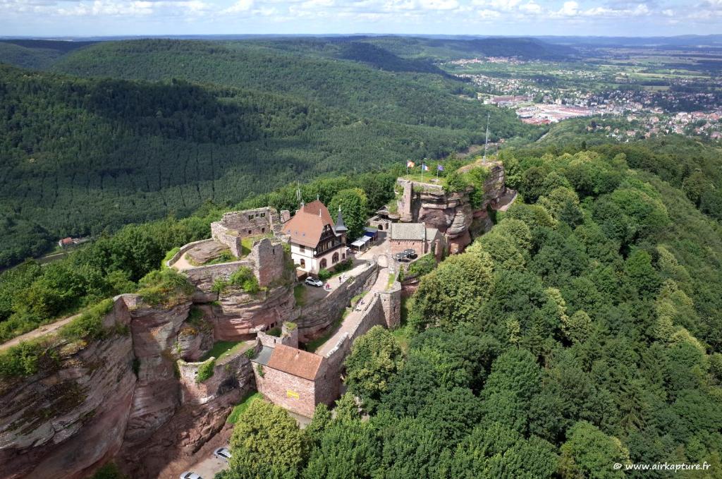 an old castle on the side of a mountain at Camping de Saverne in Saverne