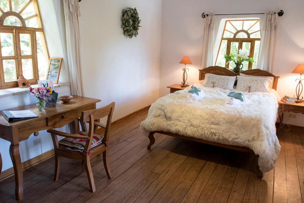 Postel nebo postele na pokoji v ubytování Las Casitas del Arco Iris