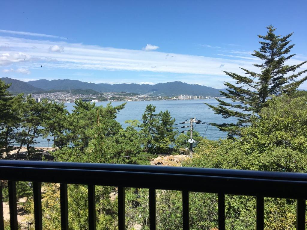 a view of the water from a balcony at Miyajima Morinoyado in Miyajima