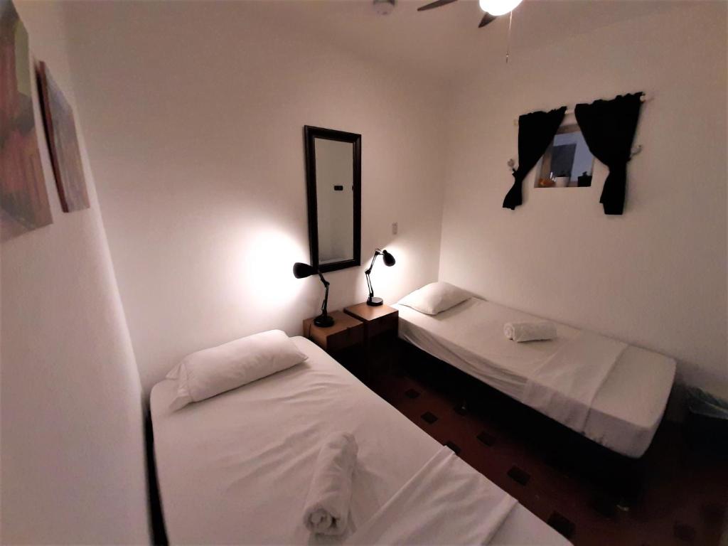 Postel nebo postele na pokoji v ubytování Noah boutique hostels Medellín