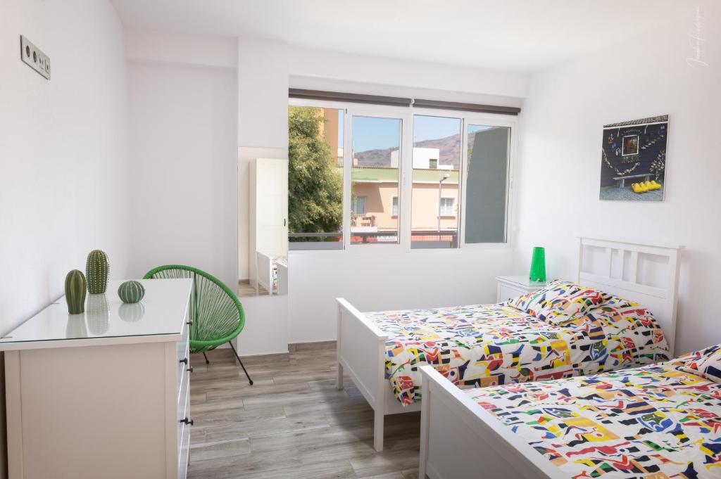 Postel nebo postele na pokoji v ubytování Apartamentos Los Laureles