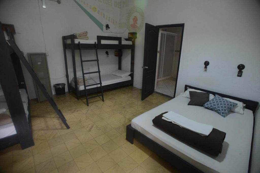 Postel nebo postele na pokoji v ubytování El Petate Hostel
