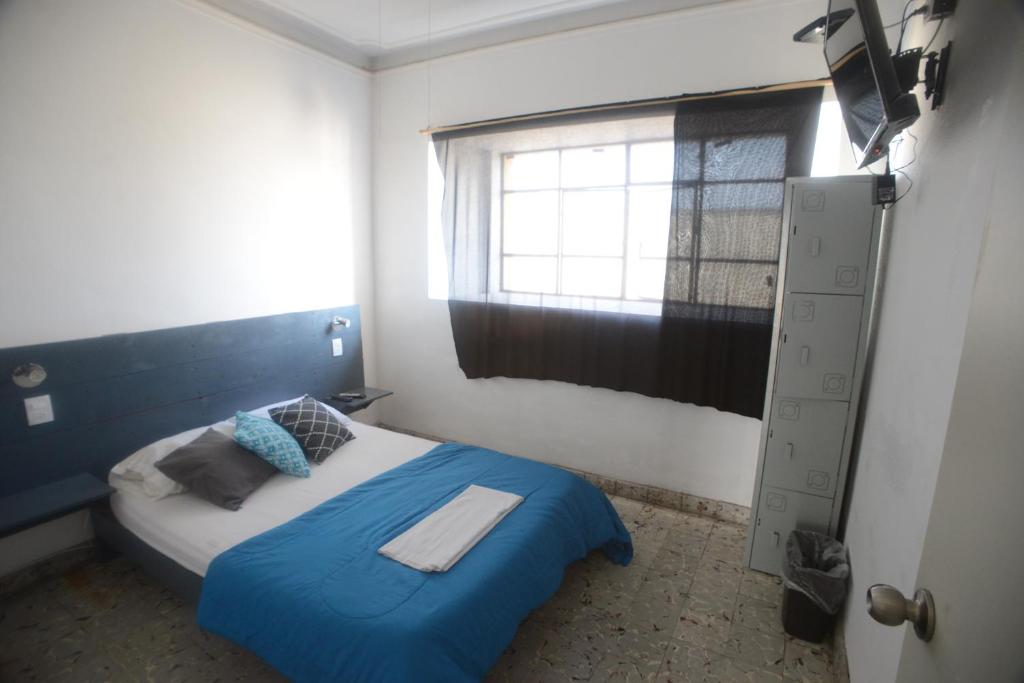 Postel nebo postele na pokoji v ubytování El Petate Hostel