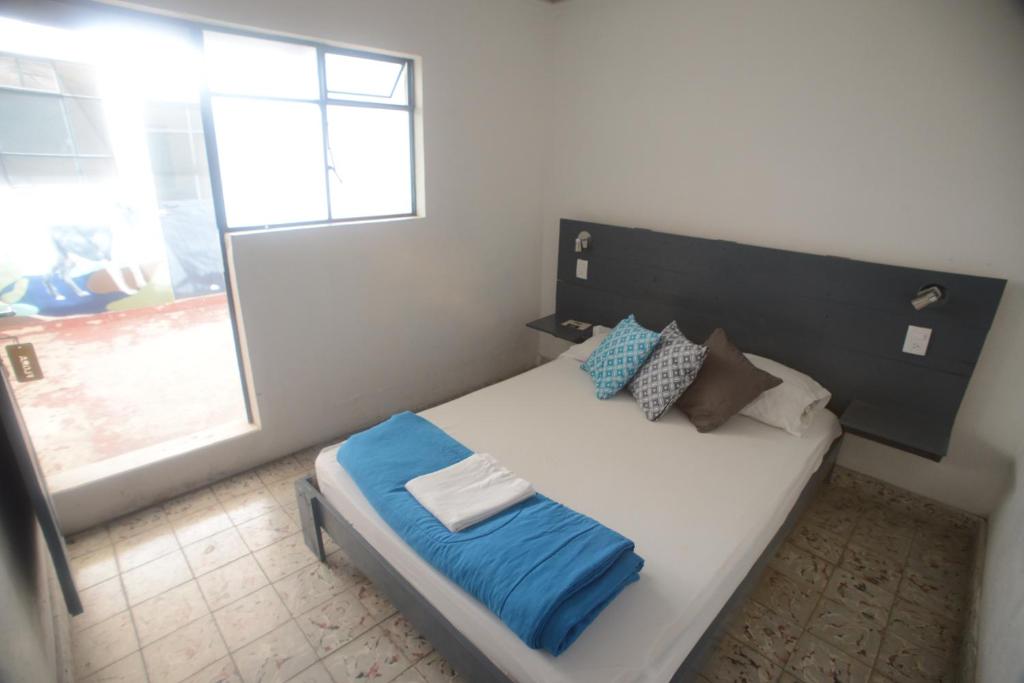 Postel nebo postele na pokoji v ubytování El Petate Hostel