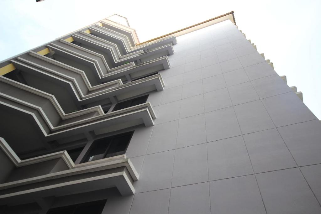 a building with a geometric pattern on the side of it at Sakun Place in Bangna