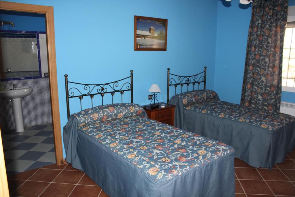 A bed or beds in a room at Casa Rural La Florentina