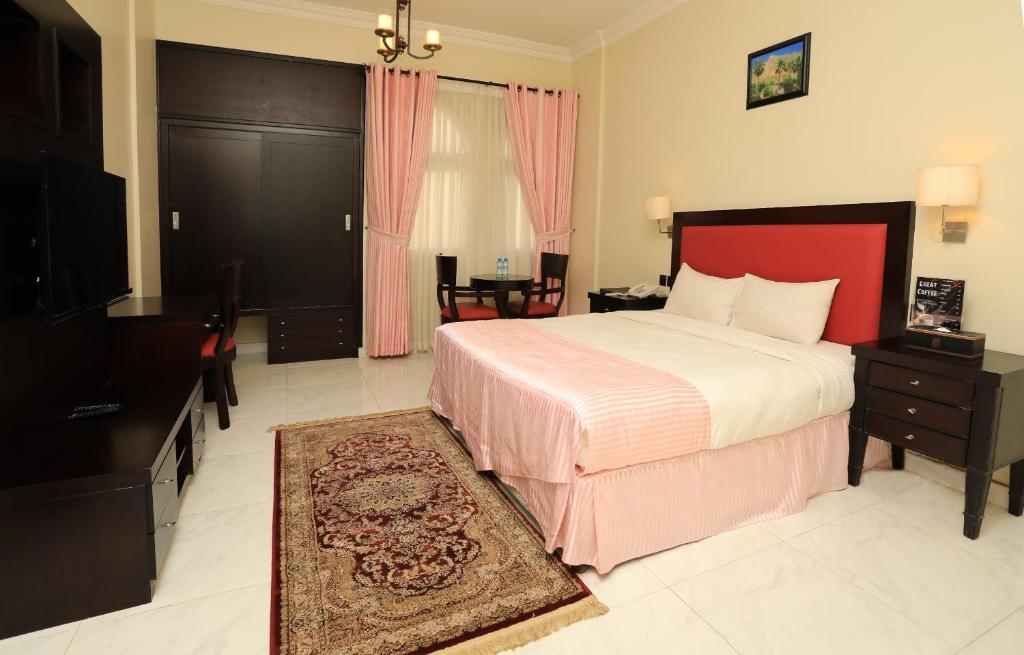 Postel nebo postele na pokoji v ubytování Remas Hotel Suites - Al Khoudh, Seeb, Muscat