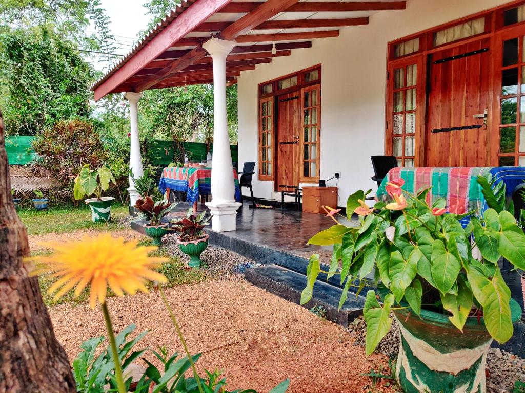a porch of a house with a patio at Sigiri Shen Residence in Sigiriya