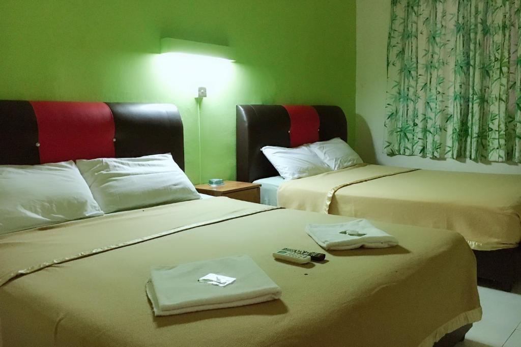 Postel nebo postele na pokoji v ubytování Dindings Pantai Desair Apartment By DPD