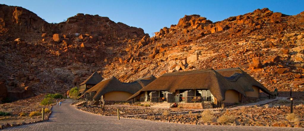 a building in the middle of a mountain at Twyfelfontein Country Lodge in Twyfelfontein