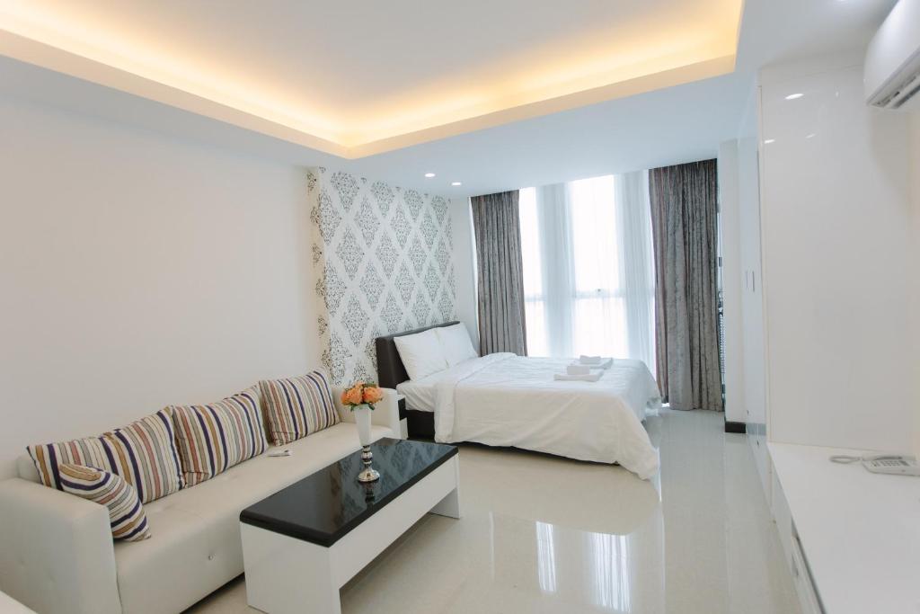 Postel nebo postele na pokoji v ubytování CA&SA Serviced Apartment