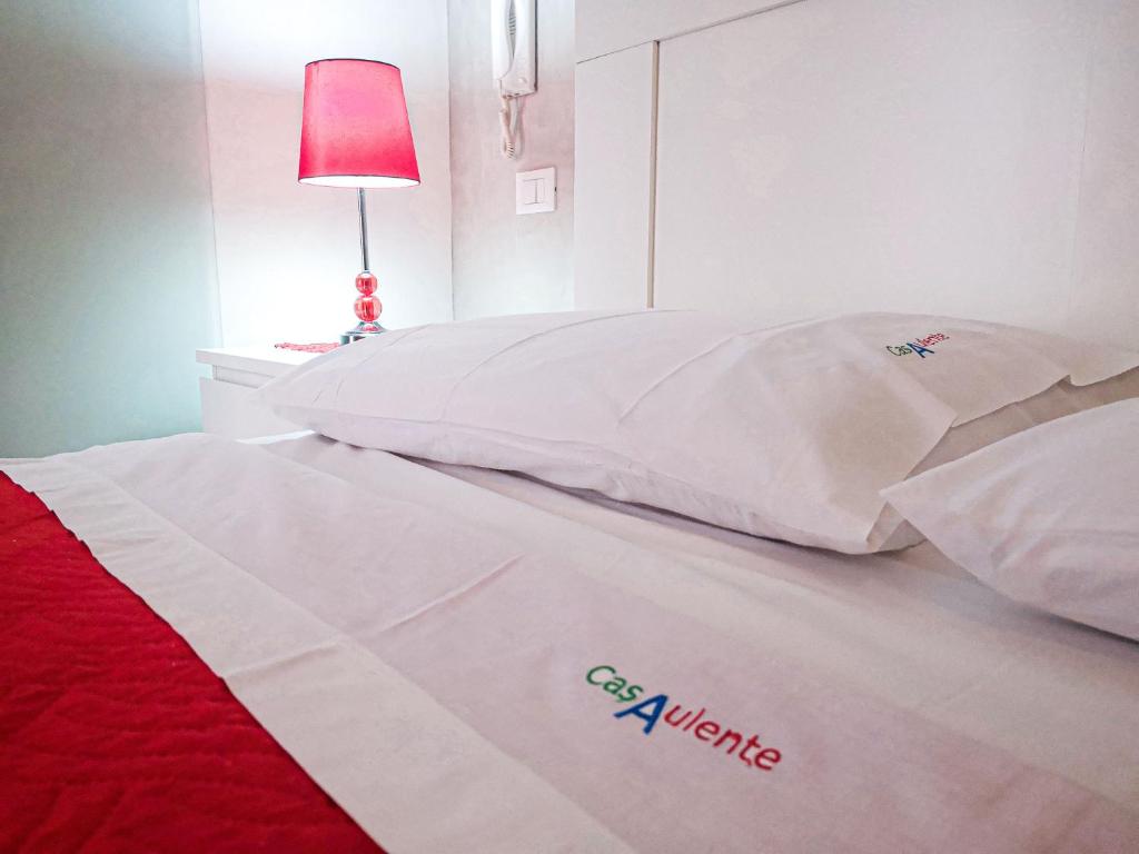 Łóżko lub łóżka w pokoju w obiekcie Casaulente