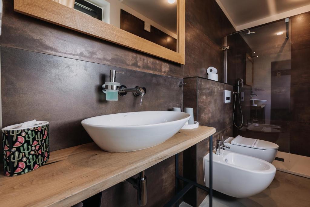 Koupelna v ubytování VILLA BRICOLA - Boutique Apartments