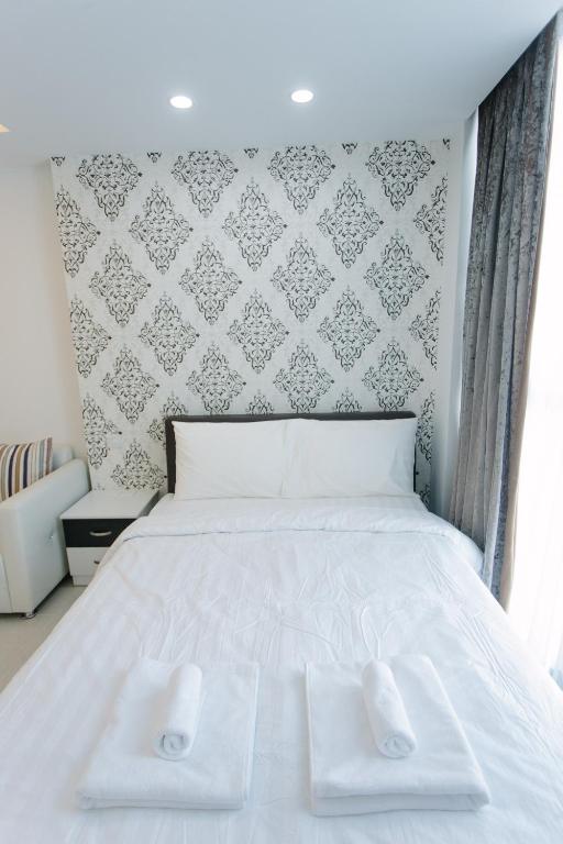 Postel nebo postele na pokoji v ubytování CA&SA Serviced Apartment