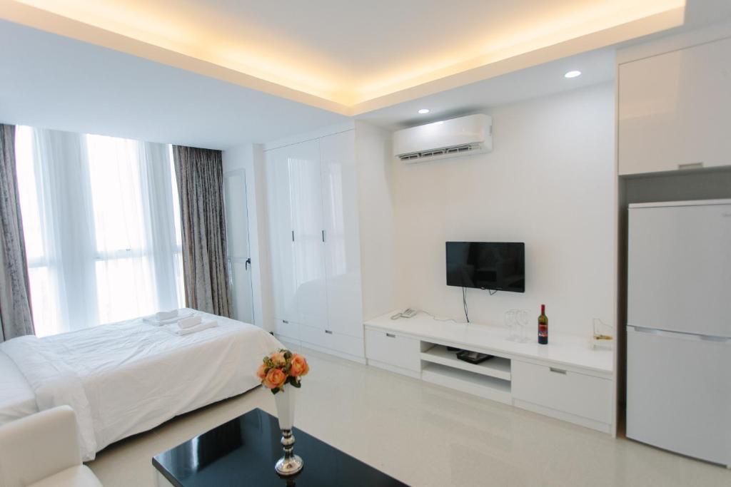 TV a/nebo společenská místnost v ubytování CA&SA Serviced Apartment