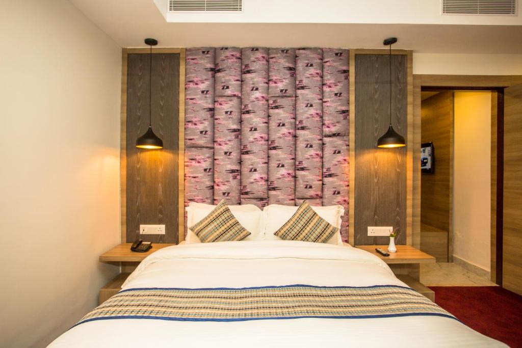 Postel nebo postele na pokoji v ubytování Hotel Siddhartha, Nepalgunj