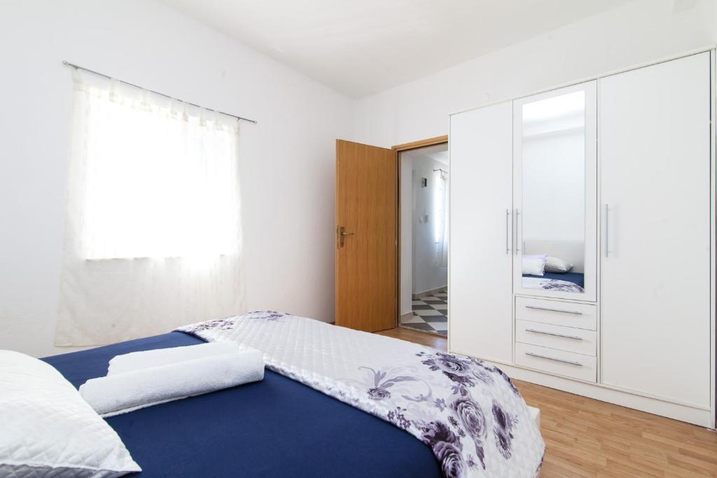 Posteľ alebo postele v izbe v ubytovaní Kuća Ella
