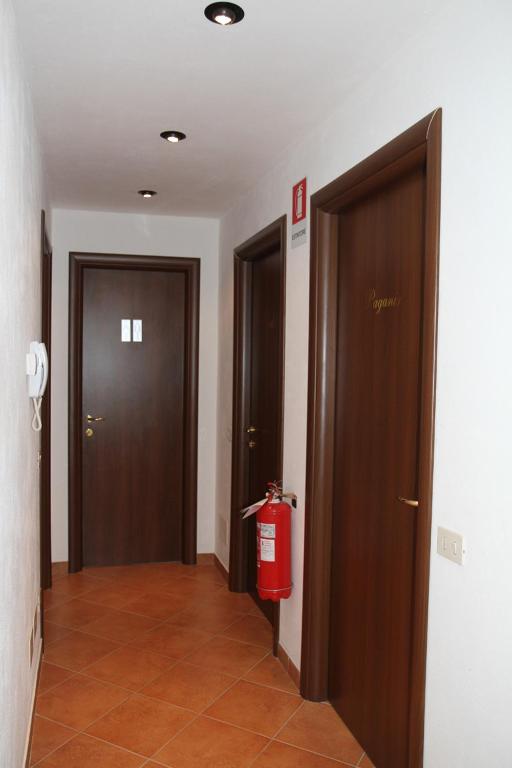 a hallway with two doors and a fire extinguisher at B&B Music in Milan