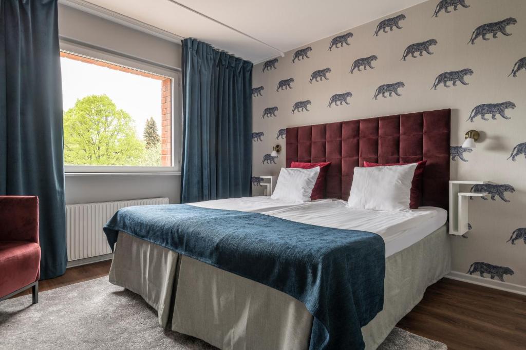Postel nebo postele na pokoji v ubytování Quality Hotel Galaxen