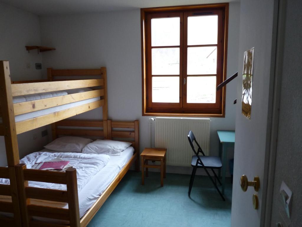 Postel nebo postele na pokoji v ubytování Gite l'Aiguillette du Lauzet
