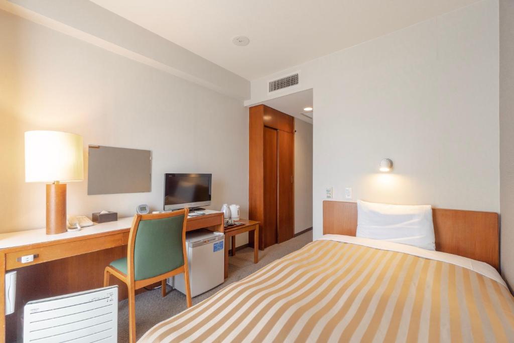 Postel nebo postele na pokoji v ubytování Hotel Gimmond Kyoto
